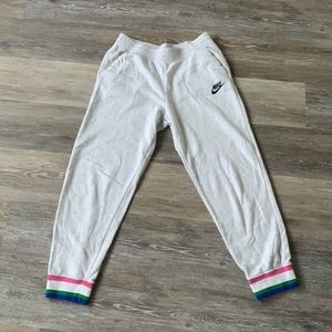 Women’s size large white Nike joggers.